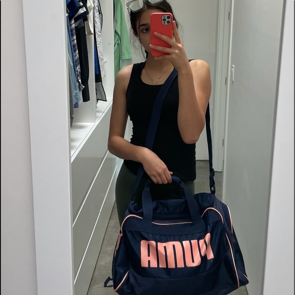 A navy blue and baby pink Puma duffel bag. - Picture 6 of 7